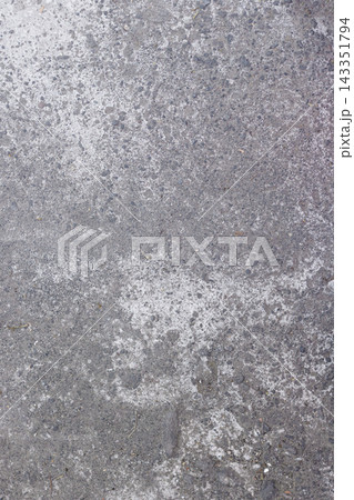 High angle view of a vertical weathered concrete pavement with rough texture, white discolored patches, and fine gravel details for graphic design backdrop. High Quality Photo High angle view of a vertical weathered concrete pavement with rough texture, white discolored patches, and fine gravel details for graphic design backdrop. High Quality Photo 143351794