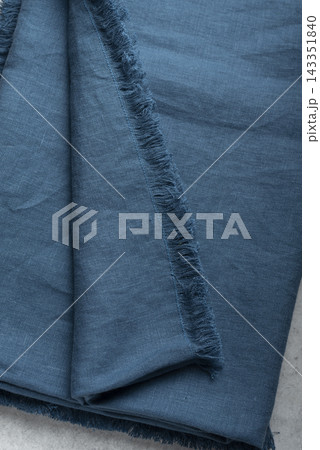 Folded Petroleum Blue Linen Tablecloth Fringed Edges Folded Petroleum Blue Linen Tablecloth Fringed Edges 143351840