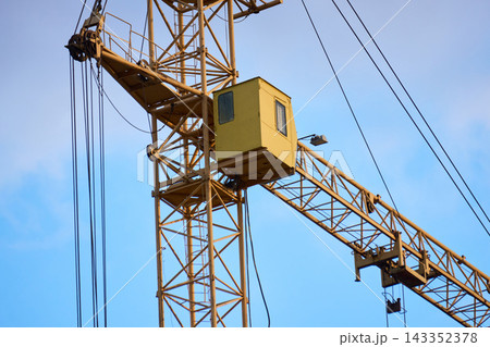 Detailed view of industrial crane trusses and pulley system Detailed view of industrial crane trusses and pulley system 143352378