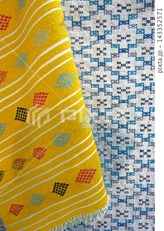 Traditional Tunisian Handcrafted Textiles and Ornate Ceramic Pillar Detail Traditional Tunisian Handcrafted Textiles and Ornate Ceramic Pillar Detail 143352571