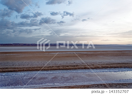 Layered Horizontal Landscape Photograph of Saline Water Channels in Arid Chott el Djerid Salt Flat Layered Horizontal Landscape Photograph of Saline Water Channels in Arid Chott el Djerid Salt Flat 143352707
