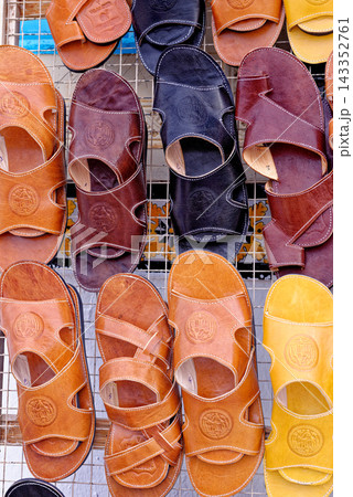 Traditional Handcrafted Leather Sandals Displayed at a Tunisian Bazaar Traditional Handcrafted Leather Sandals Displayed at a Tunisian Bazaar 143352761