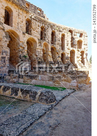 Tracking Shot of MultiTiered Arched Arena Wall and Weathered Stone Foundations inside El Jem Amphitheatre 143352799