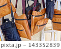 Hanging Display of Handcrafted Leather Messenger Bags and Shoulder Pouches with Zippers 143352839