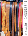 Close Up Full Frame Texture Shot of Assorted Embossed and Patterned Genuine Leather Belts 143352841