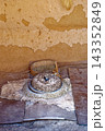 Traditional Stone Hand Quern Mill with Grain Sieve Inside Berber Mud Brick Dwelling 143352849