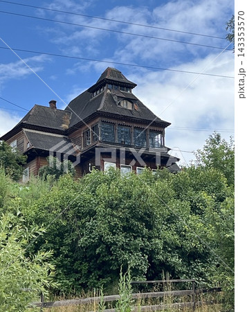 Wooden old house made of dark wood and 143353570