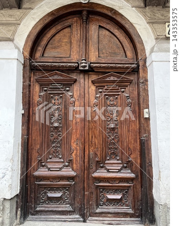 Wooden antique various doors leading to the courtyard 143353575