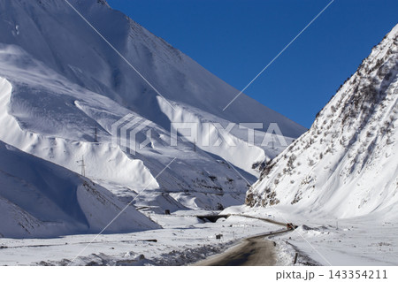 Winter Mountain Road Along the Snowy Georgian Military Highway in Caucasus Winter Mountain Road Along the Snowy Georgian Military Highway in Caucasus 143354211