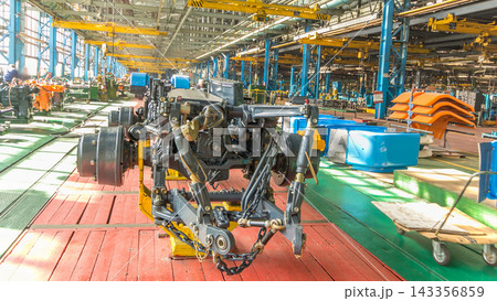 Conveyor assembly stage the body of tractor at big industrial factory timelapse 143356859