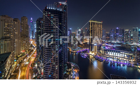 Evening illumination of Dubai Marina day to night aerial timelapse, UAE. Evening illumination of Dubai Marina day to night aerial timelapse, UAE. 143356932