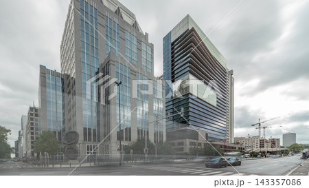 Timelapse panorama of traffic and modern office buildings in the business district on Boulevard Baudouin, Brussels, Belgium. 143357086