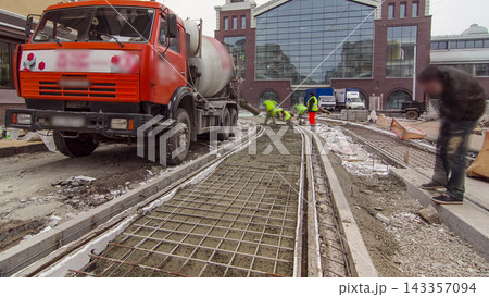 Pouring ready-mixed concrete after placing steel reinforcement to make the road by concrete mixer timelapse hyperlapse. Pouring ready-mixed concrete after placing steel reinforcement to make the road by concrete mixer timelapse hyperlapse. 143357094