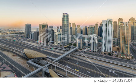 Dubai Marina skyscrapers aerial top view before sunrise from JLT in Dubai night to day timelapse, UAE. Dubai Marina skyscrapers aerial top view before sunrise from JLT in Dubai night to day timelapse, UAE. 143357104