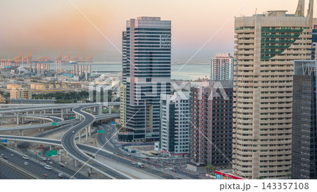 Dubai Marina skyscrapers aerial top view before sunrise from JLT in Dubai night to day timelapse, UAE. Dubai Marina skyscrapers aerial top view before sunrise from JLT in Dubai night to day timelapse, UAE. 143357108