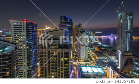 JBR and Dubai marina after sunset aerial day to night timelapse JBR and Dubai marina after sunset aerial day to night timelapse 143357109