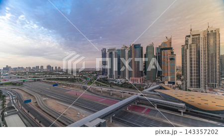 Aerial top view to Sheikh Zayed road near Dubai Marina and JLT timelapse, Dubai. Aerial top view to Sheikh Zayed road near Dubai Marina and JLT timelapse, Dubai. 143357202