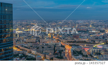 Aerial top view of Moscow city day to night timelapse after sunset. From the observation deck 143357327