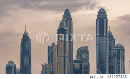 Modern skyscrapers in Dubai city night to day timelapse from the Palm Jumeirah Island. Modern skyscrapers in Dubai city night to day timelapse from the Palm Jumeirah Island. 143357338