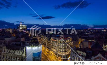 Panoramic aerial view of Gran Via day to night timelapse, Skyline Old Town Cityscape, Metropolis Building, capital of Spain Panoramic aerial view of Gran Via day to night timelapse, Skyline Old Town Cityscape, Metropolis Building, capital of Spain 143357376