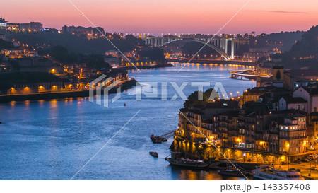 Day to night view of the historic city of Porto, Portugal timelapse from the Dom Luiz bridge Day to night view of the historic city of Porto, Portugal timelapse from the Dom Luiz bridge 143357408