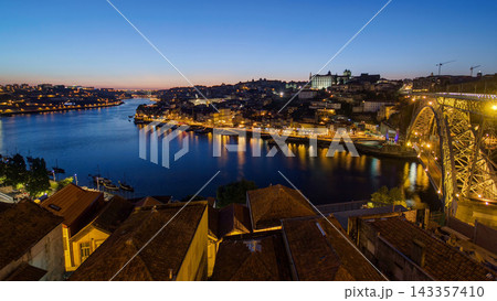 Panorama of old city Porto at river Duoro after sunset day to night timelapse, Oporto, Portugal Panorama of old city Porto at river Duoro after sunset day to night timelapse, Oporto, Portugal 143357410