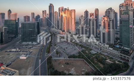 Panorama of Business bay Dubai night to day aerial timelapse. 143357576