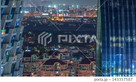 Aerial view to neighborhood Deira and Dubai creek with typical old and modern buildings day to night timelapse. Aerial view to neighborhood Deira and Dubai creek with typical old and modern buildings day to night timelapse. 143357587