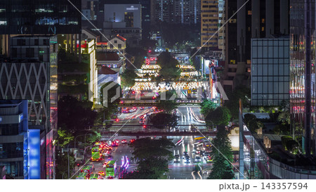 Traffic with cars on a street and urban scene in the central district of Singapore day to night timelapse 143357594