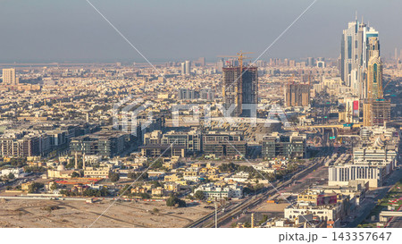 Skyscrapers and traffic on Sheikh Zayed Road aerial timelapse in Dubai, UAE. Skyscrapers and traffic on Sheikh Zayed Road aerial timelapse in Dubai, UAE. 143357647