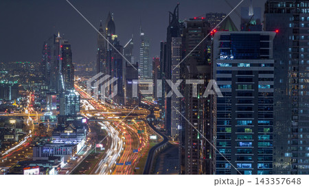 Aerial view to skyscrapers on Dubai downtown and Sheikh Zayed road night timelapse, Dubai, United Arab Emirates Aerial view to skyscrapers on Dubai downtown and Sheikh Zayed road night timelapse, Dubai, United Arab Emirates 143357648