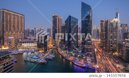 Beautiful aerial top view day to night transition timelapse of Dubai Marina canal Beautiful aerial top view day to night transition timelapse of Dubai Marina canal 143357658