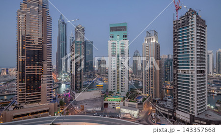 Beautiful aerial top view day to night transition timelapse of Dubai Marina canal 143357668