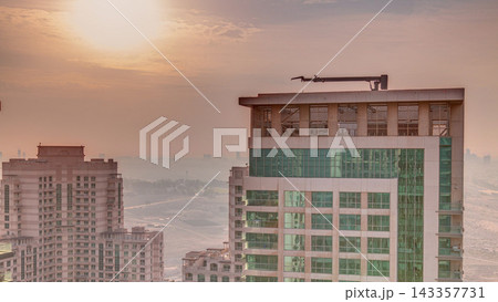 Sunrise over towers in Greens district aerial view from top timelapse. Sunrise over towers in Greens district aerial view from top timelapse. 143357731