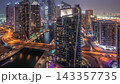 Aerial view of Dubai Marina residential and office skyscrapers with waterfront day to night timelapse 143357735