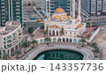 Modern residential architecture of Dubai Marina and Mohammed Bin Ahmed Almulla Mosque aerial night to day timelapse 143357736