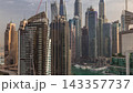 View of various skyscrapers and towers in Dubai Marina from above aerial timelapse 143357737