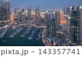 Aerial top view of Dubai Marina day to night timelapse. Modern towers and traffic on the road 143357741