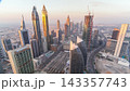 Skyline view of the buildings of Sheikh Zayed Road and DIFC aerial timelapse in Dubai, UAE. 143357743