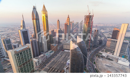 Skyline view of the buildings of Sheikh Zayed Road and DIFC aerial timelapse in Dubai, UAE. Skyline view of the buildings of Sheikh Zayed Road and DIFC aerial timelapse in Dubai, UAE. 143357743