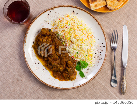 Spicy lamb stew in thick sauce is called karahi according to Pakistani recipe Spicy lamb stew in thick sauce is called karahi according to Pakistani recipe 143360356