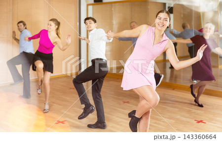 young woman with partner dance jive young woman with partner dance jive 143360664