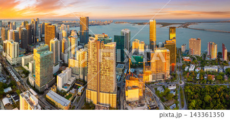 Downtown district of Miami Brickell in Florida, USA. Evening urban landscape of waterfront skyscraper buildings in modern American megapolis 143361350