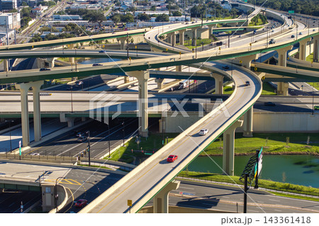 Complex freeway interchange in downtown Orlando, Florida with elevated roads, bridges and city infrastructure defining modern American metropolis. Complex freeway interchange in downtown Orlando, Florida with elevated roads, bridges and city infrastructure defining modern American metropolis. 143361418