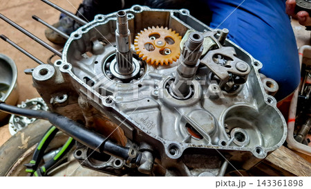 Open Motorcycle Crankcase Internal Gears and Shaft Open Motorcycle Crankcase Internal Gears and Shaft 143361898
