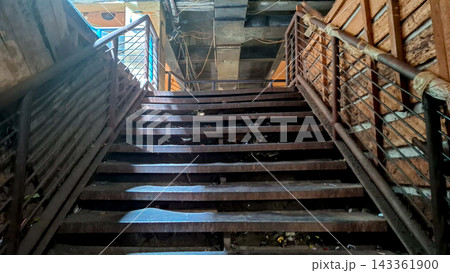 Old Concrete Stairs Under Bridge with Metal Railing 143361900