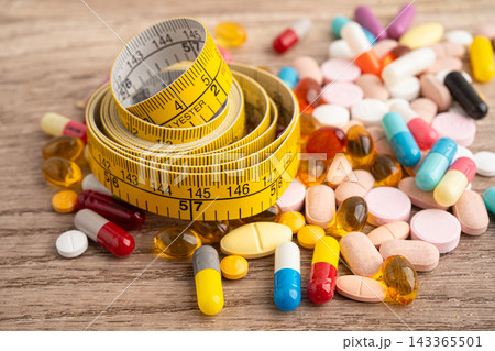 Measuring tape and tablet drug medical for diet. Measuring tape and tablet drug medical for diet. 143365501