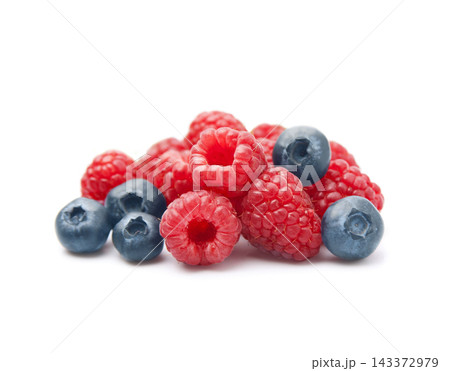 Ripe raspberry and blueberries on white backgrounds Ripe raspberry and blueberries on white backgrounds 143372979