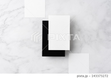 Blank white business cards and close black aluminum card holder on white marble background, top view flat lay with copy space Blank white business cards and close black aluminum card holder on white marble background, top view flat lay with copy space 143373272