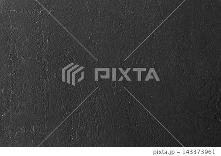 Black Rough Wall Texture. Dark charcoal black wall with subtle rough plaster texture, uneven surface detail. Minimal monochrome background suitable for graphic design, presentations and overlays Black Rough Wall Texture. Dark charcoal black wall with subtle rough plaster texture, uneven surface detail. Minimal monochrome background suitable for graphic design, presentations and overlays 143373961